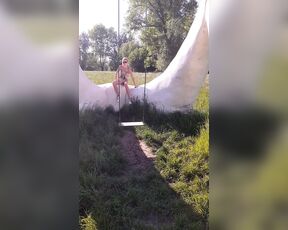 In Flemish Fields Crazy Naked swinging and smashing the camera